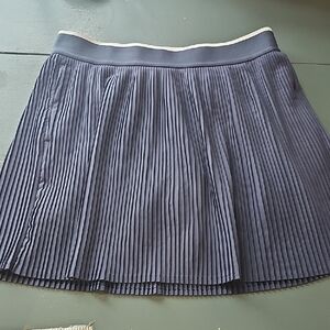 Calla Acodian‎ Pleated Skater Skort with White-Trim Waistband.